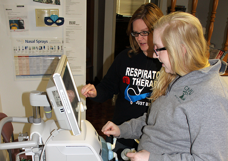 Blessing-Rieman respiratory students Kim Hiatt (background) and Teddi Neil (foreground) work with the Drager Babylog VN500 ventilator.