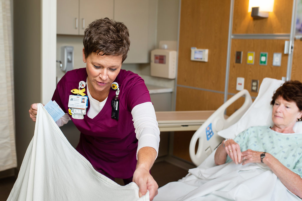 CNA at patient bedside