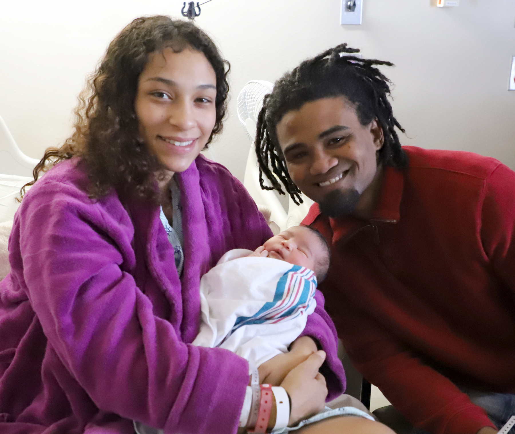 Kyla Abbey with parents Cole Abbey and Heather Osborne of Quincy