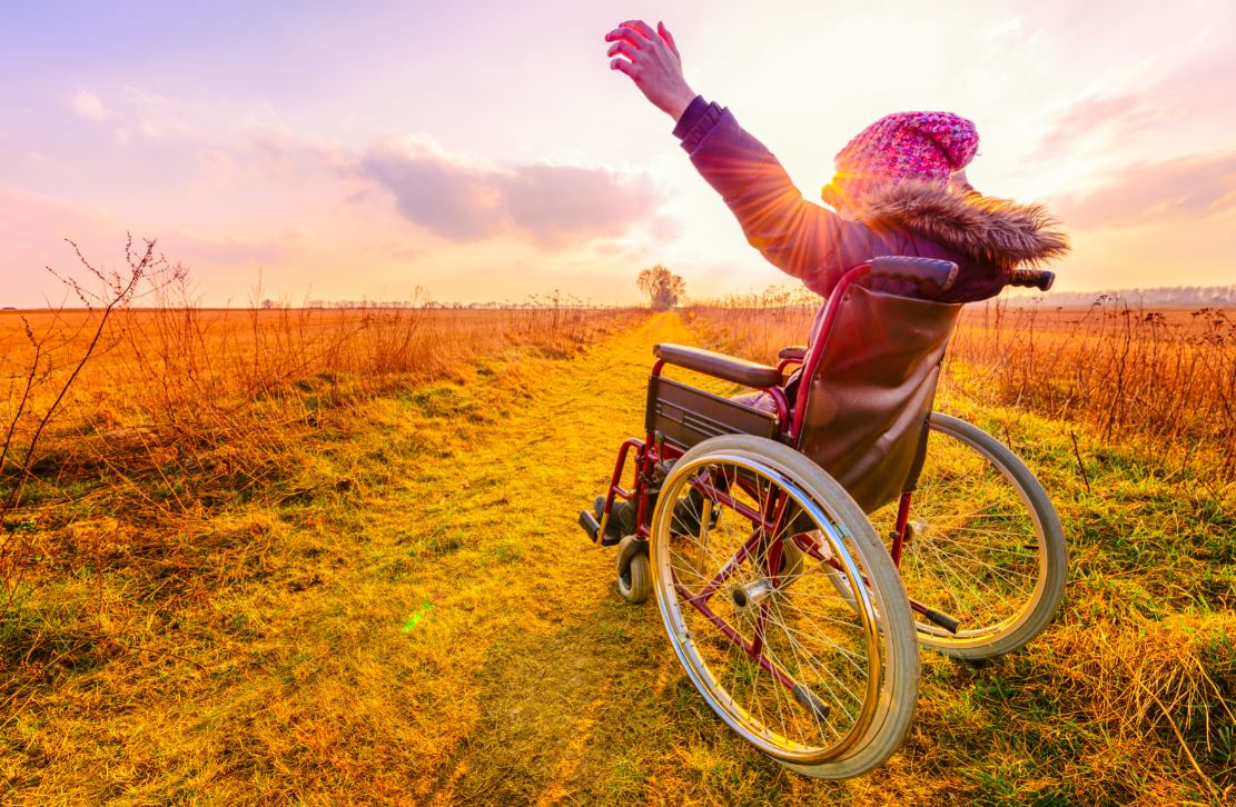 Girl in wheelchair outdoors