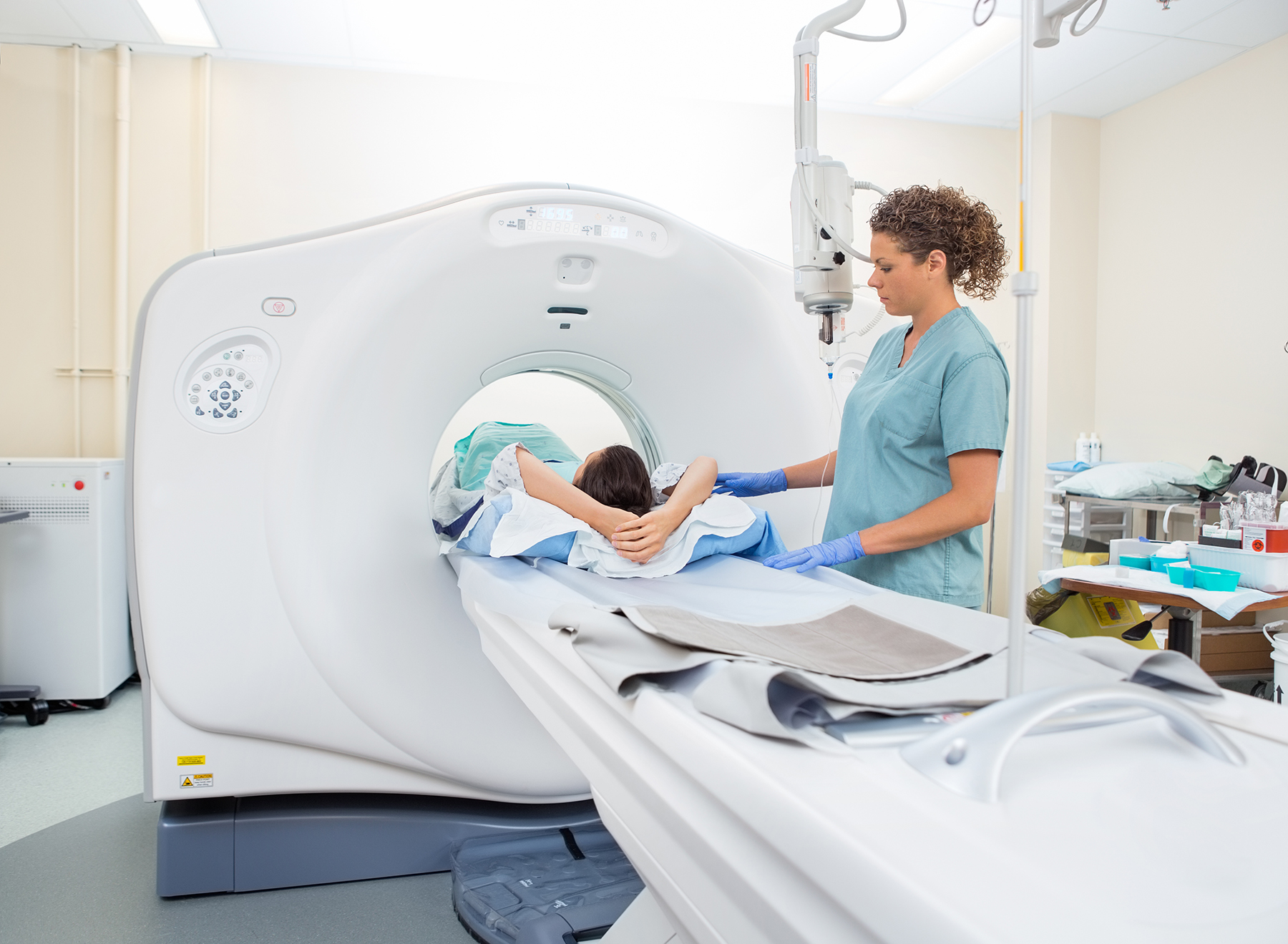 CT Tech with Patient in Scanner