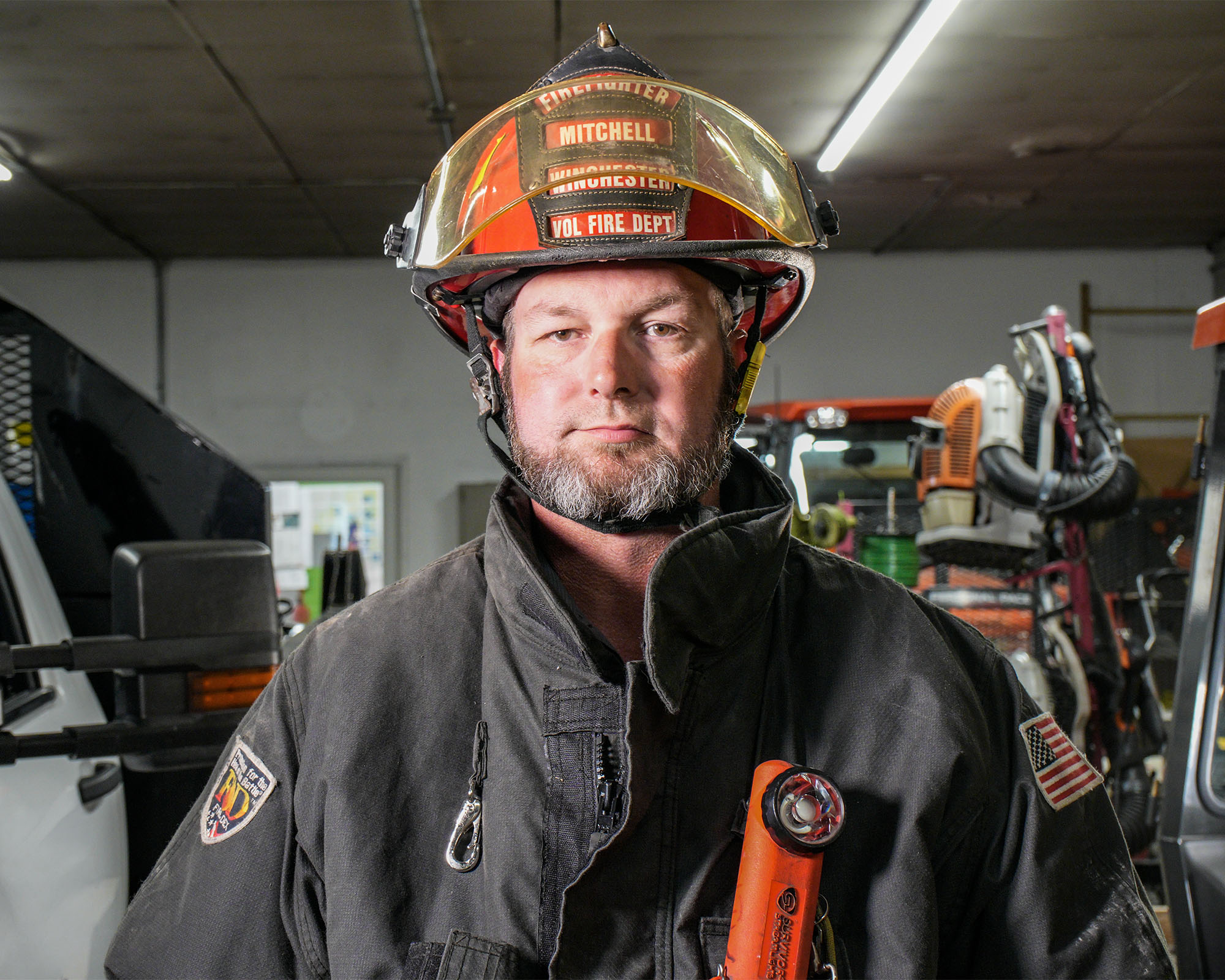 Stacey Mitchell standing in his firefighter's gear