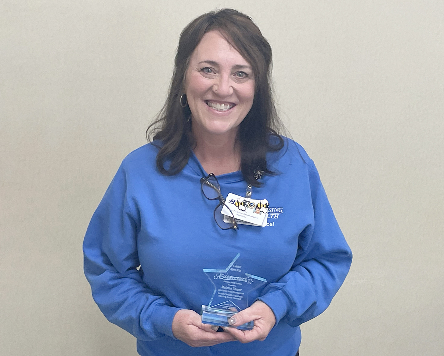 Melanie Garner the ICARE Award with her Excellence