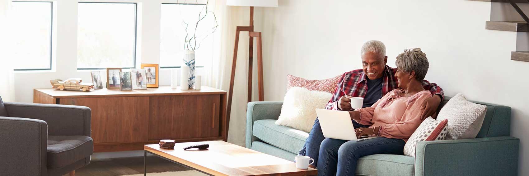 Senior Couple Sitting on Couch