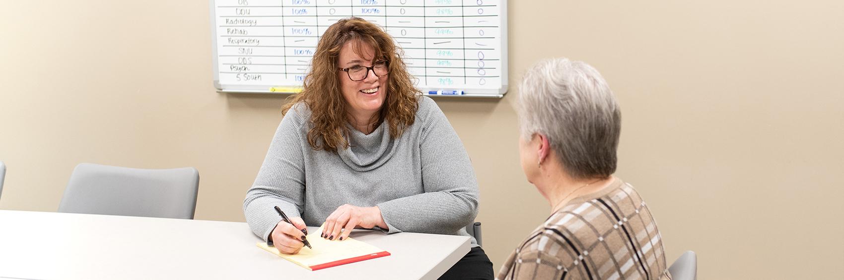 Rosie talking to patient