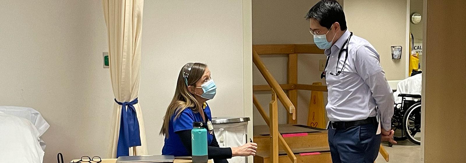 Doctor talking to nurse