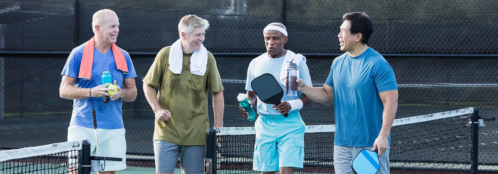 Men Talking on tennis court